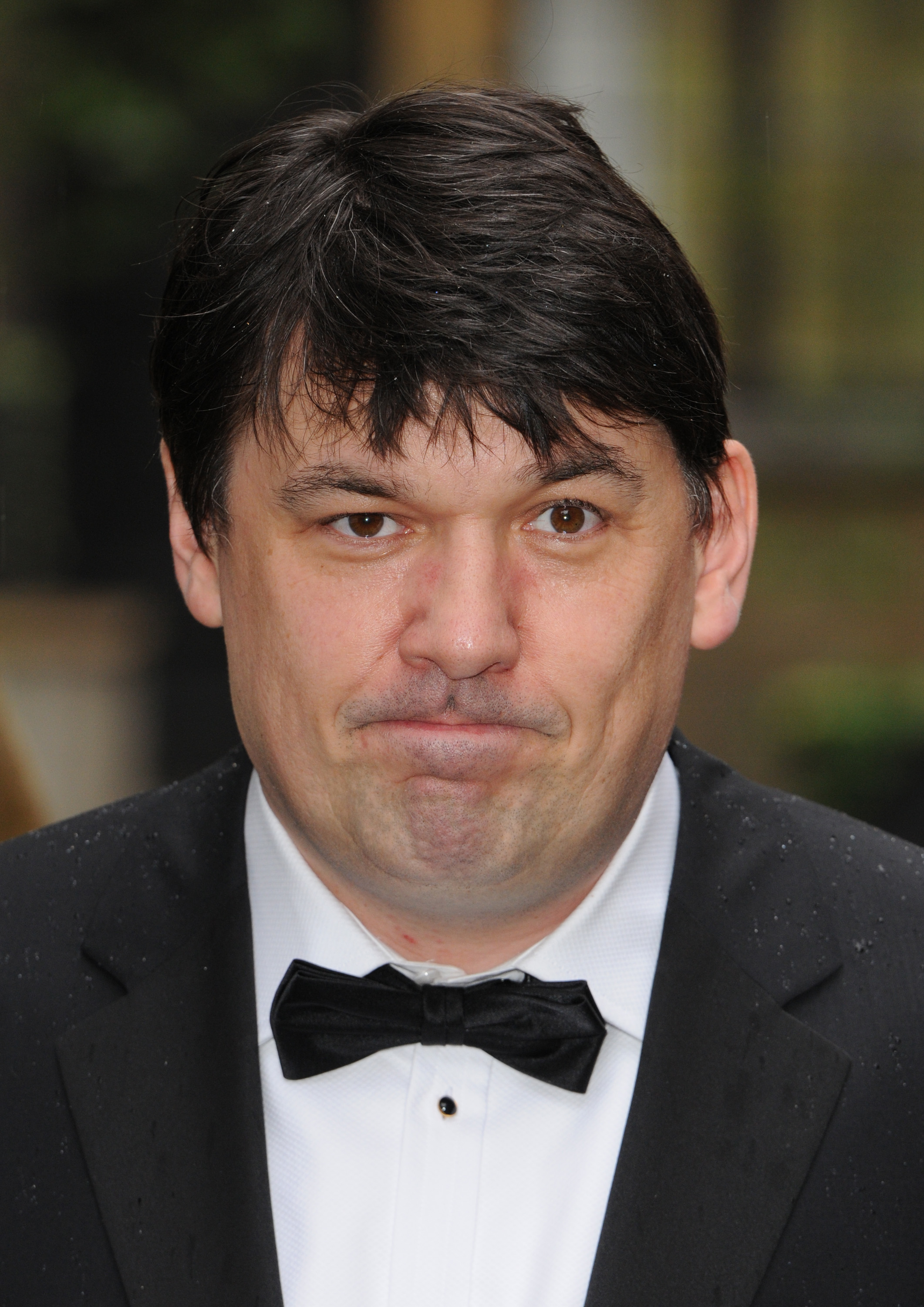 Graham Linehan attending the BAFTAs. He is wearing a black tuxedo and bowtie