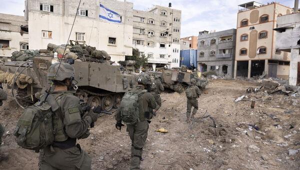 Israeli soldiers take part in a ground operation in Gaza City's Shijaiyah neighbourhood. Picture: Moti Milrod, Haaretz/AP Photo