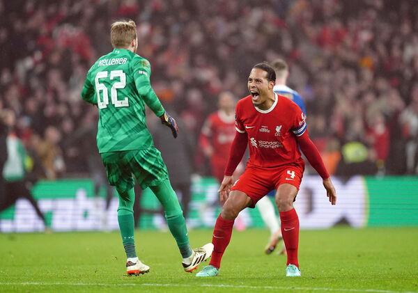 Liverpool goalkeeper Caoimhin Kelleher and Virgil van Dijk celebrate after the final whistle of the Carabao Cup final. Picture: Nick Potts/PA Wire.