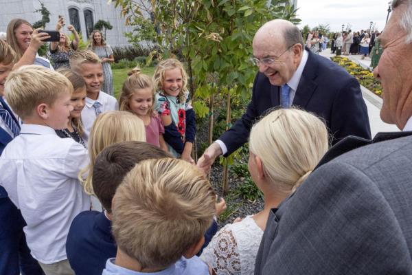 Elder Quentin L. Cook greets members after he dedicated the Moses Lake Washington Temple on Sunday, Sept. 17, 2023.