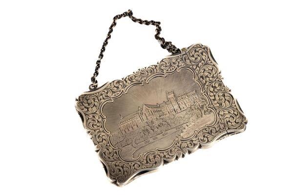 A Victorian silver card case depicting Queen's College, Cork, at Fonsie Mealy.