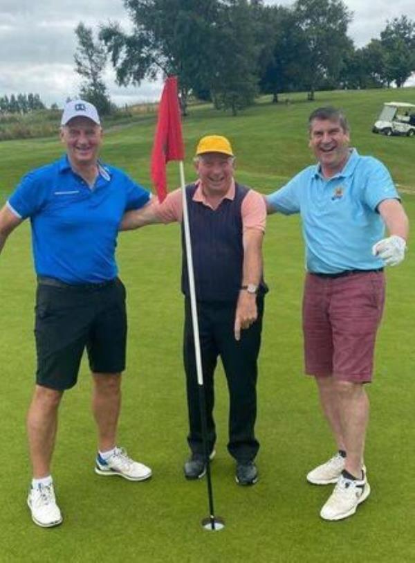 Johnny Flaherty (centre) with Offaly greats Joe Dooley (L) and Michael Duignan (R) after Flahery's hole-in-one at Esker Hills Golf Club.