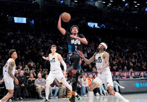 Cameron Johnson #2 of the Brooklyn Nets goes up for a shot as Jordan Clarkson #00 of the Utah Jazz defends