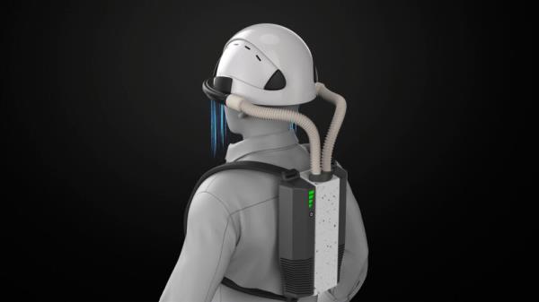 An animation screenshot shows a simulated worker wearing a hardhat connected by two air tubes to a backpack that houses the device's cold plasma module. Air is shown flowing downward from the brim of the hat.