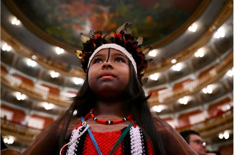 An Indigenous child attends an event at the Teatro da Paz in Belem, Brazil, ahead of a South American summit on protecting the A