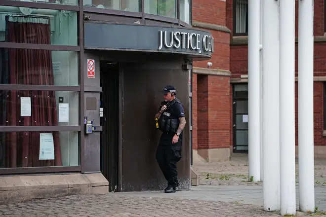 A police officer outside Nottingham Magistrates' Court