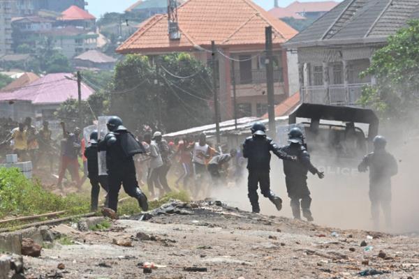 Gunfire erupts near Guinea’s presidential palace and the military locks down the area