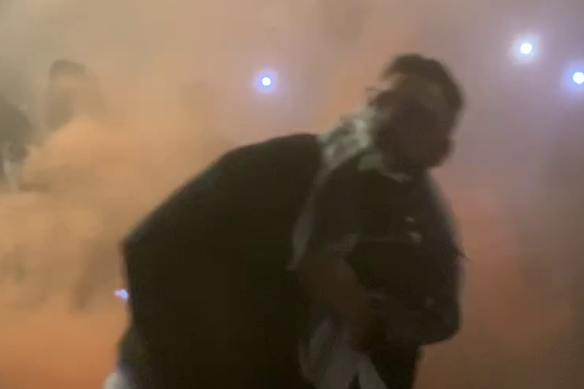 NSW Police have released footage of a man throwing a flare at the Opera House protest.