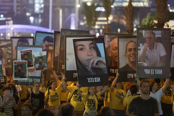 Israelis take part in a march marking 300 days since the deadly October 7 attack and calling for an immediate release of hostages being held in Gaza, in Tel Aviv, Israel, on August 1.