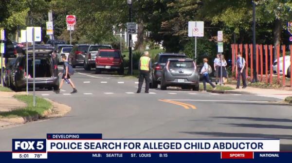 Police officer on a street in Manassas, Virginia, location of an arrest related to a student abduction case