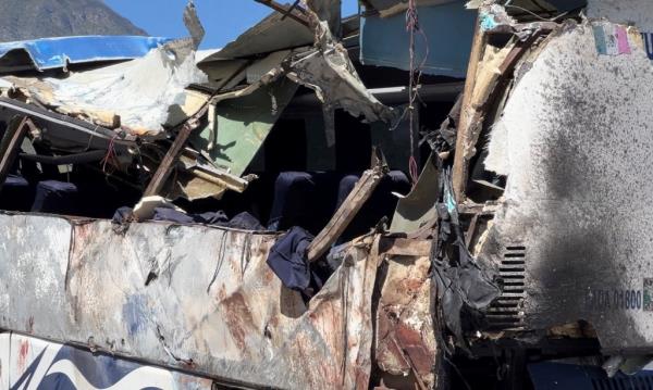 A general view shows a damaged part of a bus.