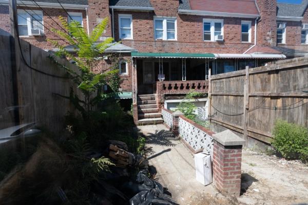 Homes on Minna Street, where one neighbor said raccoons run rampant in the backyards.